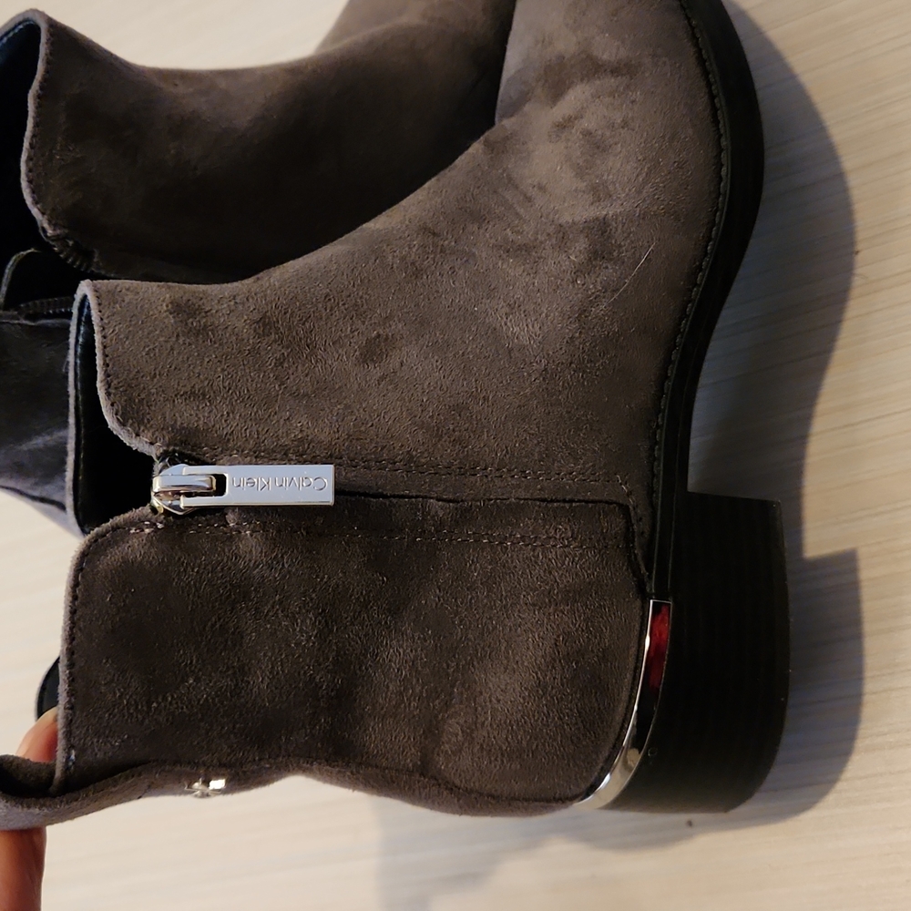 Grey suede ankle boots with sophisticated silver accents